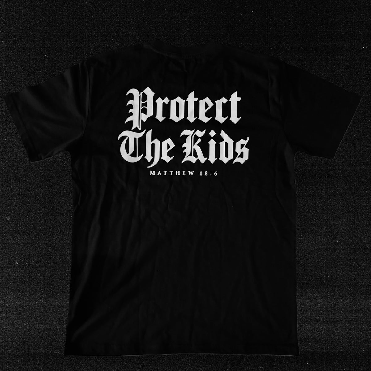 Protect The Kids Matthew 18:6 black Violent Community T-shirt back view
