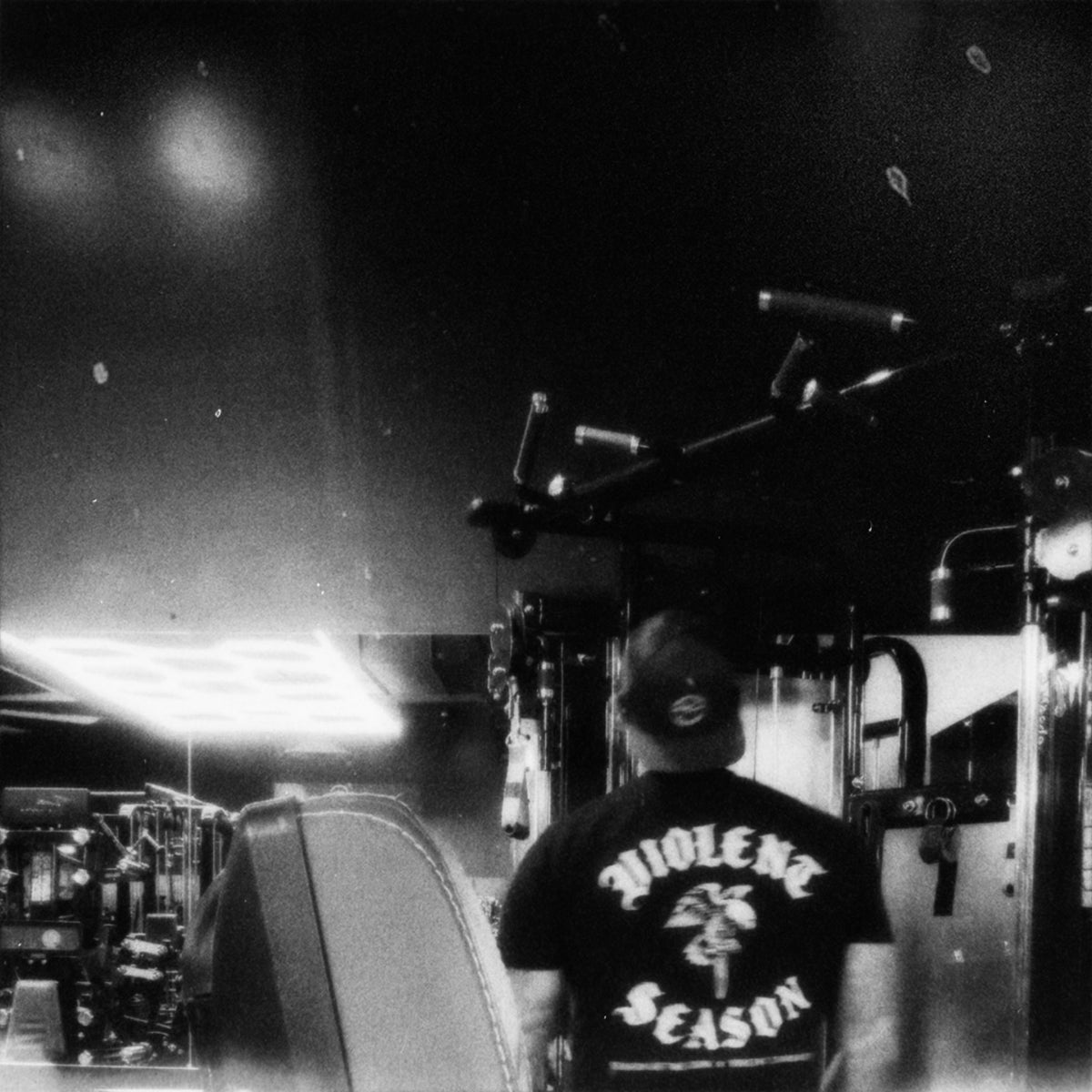 Community member wearing the Violent Season shirt at the gym, showing the back print