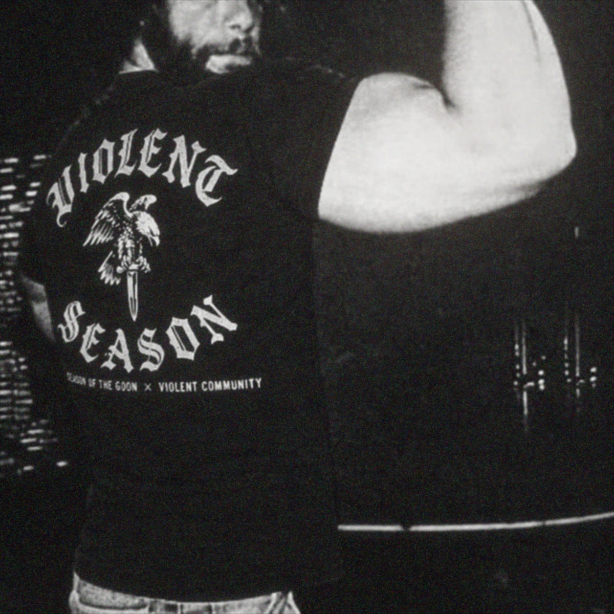 Violent Season shirt worn by a community member — grainy black and white photo