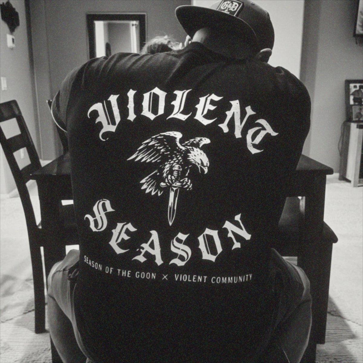 Community member wearing the Violent Season shirt in black and white.